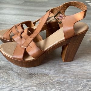 Brown leather wedge with wood heel.